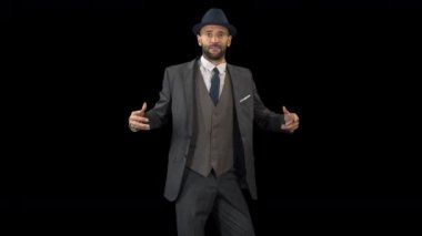 çağdaş bir tarzda siyah arka plan üzerine dans akıllı takım elbiseli usta erkek dansçı