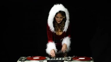 güzel Bayan santa claus DJ'lik ve bir partide dans