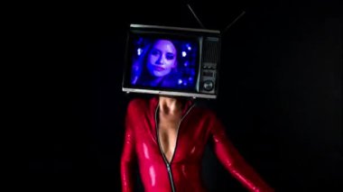 Woman posing with television on head