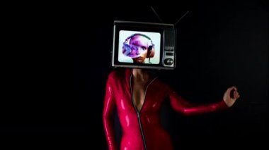 Woman posing with television on head 