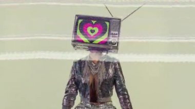 Woman posing with television on head
