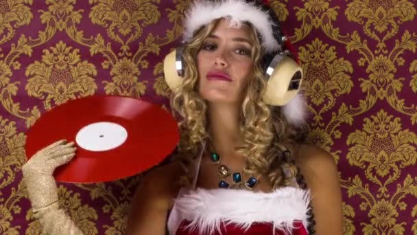 Beautiful Blonde Woman Cute Santa Claus Costume Waving Vinyl Record — Stock Video