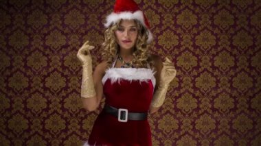 güzel sarışın kadın dansları sevimli Noel Baba kostüm karşı Noel zaman disko çekimi için klasik duvar kağıdı