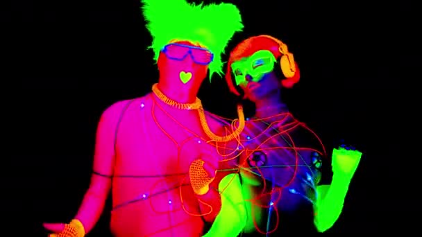 Man Woman Fluorescent Clothing Tied Together Led Cables — Stock Video
