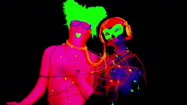 Man Woman Fluorescent Clothing Tied Together Led Cables — Stock Video