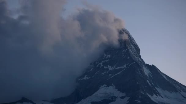 zooming time lapse of the amazing matterhorn and surrounding mountains in the Swiss Alps with fantastic cloud formations