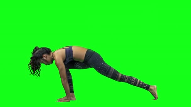 Young Woman Doing Yoga Green Background — Stock Video