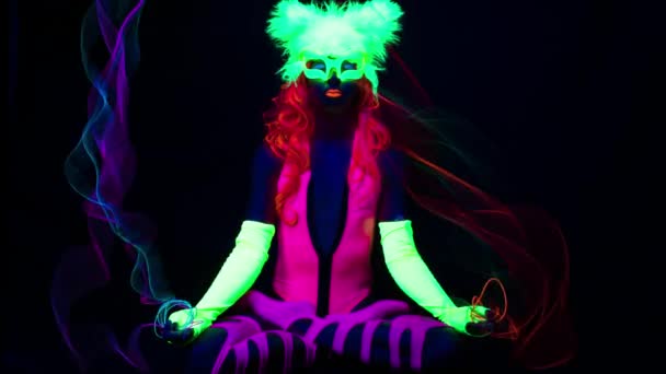 Female Yoga Lotus Prayer Pose Wearing Fluorescent Clothing Black Light — Stock Video