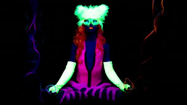 Female Yoga Lotus Pose Fluorescent Clothing Black Light — Stock Video