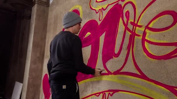 Process Graffiti Artist Spraying Word Love Concrete Wall — Stock Video