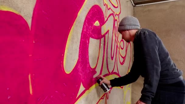 Process Graffiti Artist Spraying Word Love Concrete Wall — Stock Video