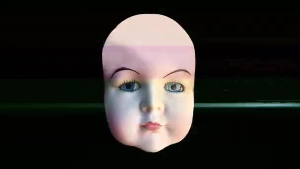 黒い背景にアニメーションの表情を持つ人形の頭 — ストック動画
