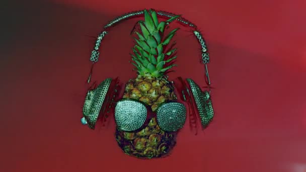 Pineapple Sunglasses Headphones Black Background — Stock Video