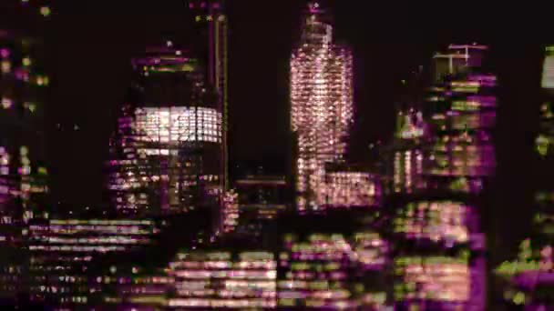 Glitching video of illuminated city buildings, London, England — Stock Video