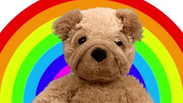 Медведь Тедди танцует на радужном фоне — стоковое видео