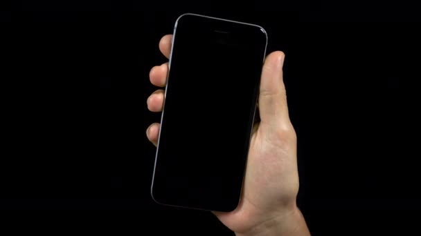 空白の画面で携帯電話を持っている人のビデオ — ストック動画