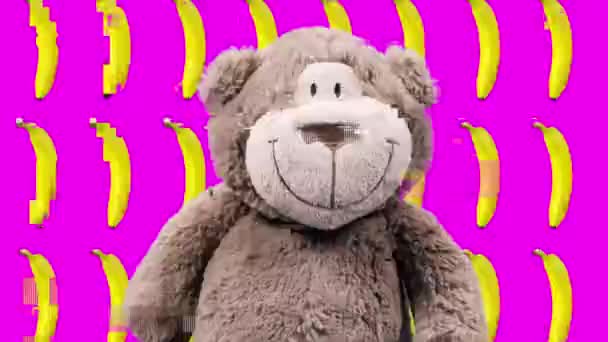 Oyuncak maymunun muzların önünde dans edişinin animasyon görüntüleri. — Stok video