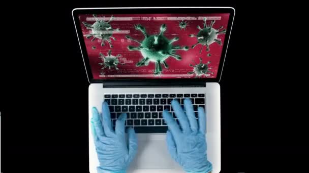 Persona que usa guantes usando computadora portátil con virus en la pantalla — Vídeos de Stock