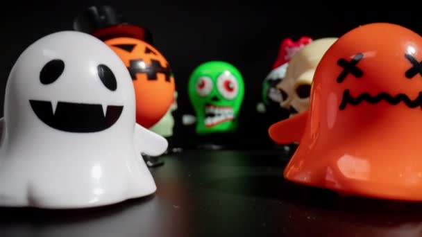 Plastic halloween toys with close up of green skull — Stock Video