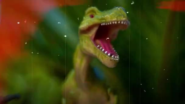 Toy dinosaur in green foliage — Stock Video