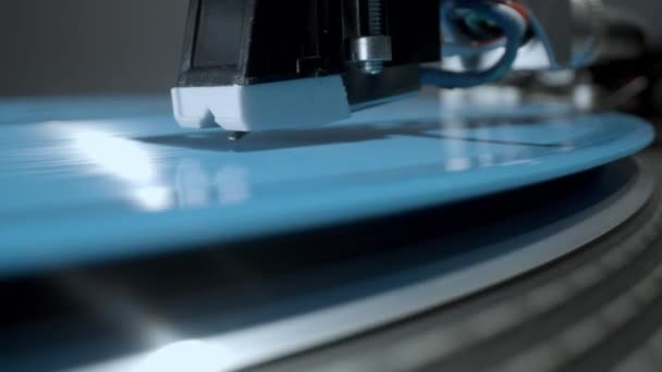 Stylus on record player with blue vinyl — Stock Video