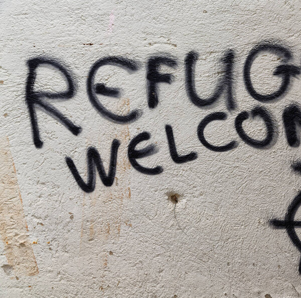 in cyprus the spray paint in the wall with refugees welcome like concept of hospitality 