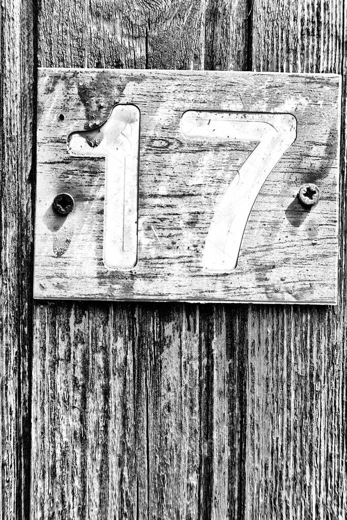 in cyprus in the old door the number seventeen in a rusty and dirty plate concept of 
