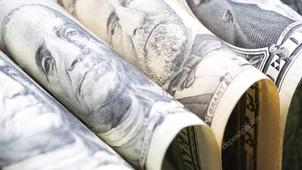 close-up view of rolled dollar banknotes, economy concept 