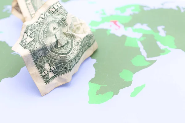 blurred   money in the world map  background like concept of buy the planet with dollar