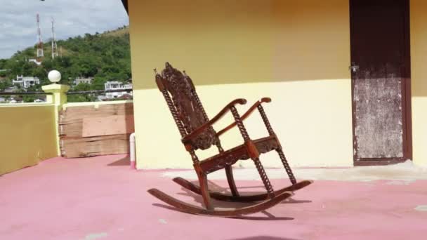 Empty rocking chair on old dirty terrace in philippines — Stock Footage Empty Rocking Chair Old Dirty Terrace Philippines Video Clip