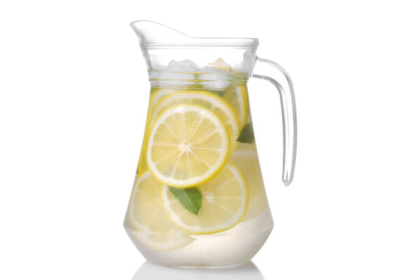 Homemade lemonade with mint and ice with a glass jug on a white background. isolated