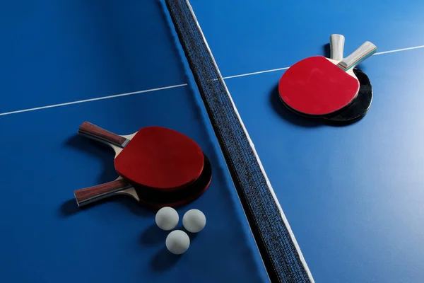 Ping pong. Accessories for table tennis racket and ball on a blue tennis table. Sport. Sport game.