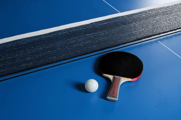 Ping pong. Accessories for table tennis racket and ball on a blue tennis table. Sport. Sport game.