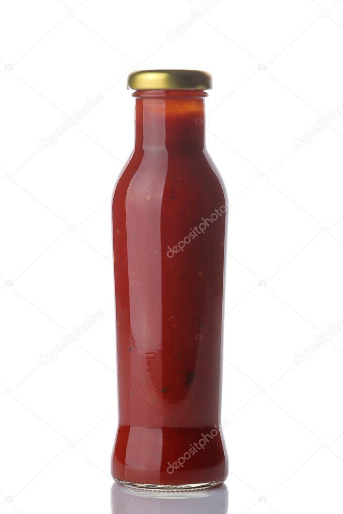 Red sauce in a bottle on a white isolated background. Tomato sauce. Ketchup