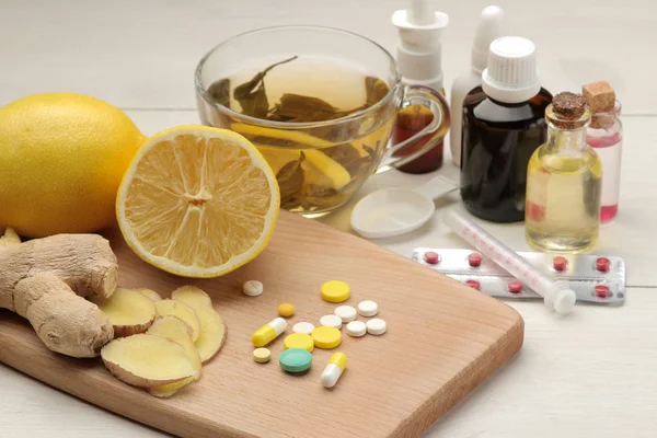 Various medicines for flu and cold remedies on a white wooden table .. Cold. diseases. cold. flu.