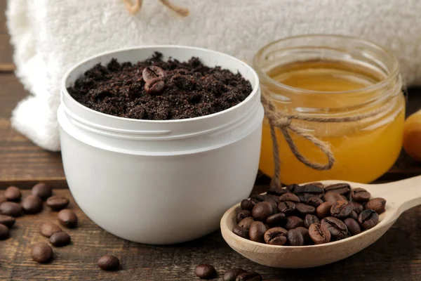 homemade coffee scrub in a white jar for the face and body and various ingredients for making scrub. spa. cosmetics. care cosmetics