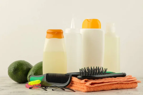 Various hair care products and various hair accessories on a light background. hair cosmetics.