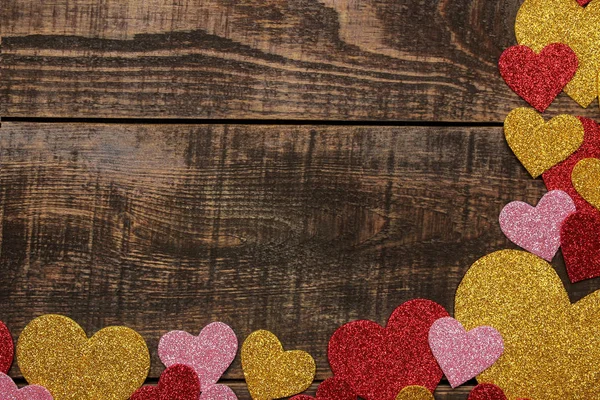 Multicolored Shiny Hearts Brown Wooden Background Frame Hearts Top View — Stock Photo, Image