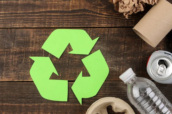 Eco symbol. recycling. Eco concept on brown wooden table. waste recycling. top view.