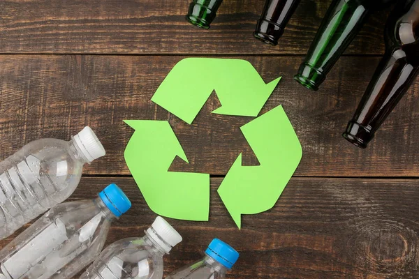 Eco symbol. recycling. Eco concept on brown wooden table. waste recycling. top view.