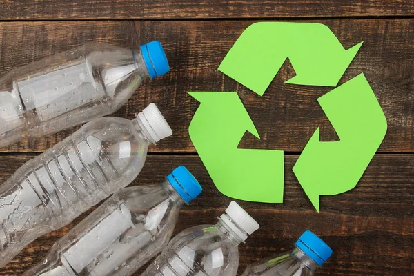 Eco symbol. recycling. Eco concept on brown wooden table. waste recycling. top view.