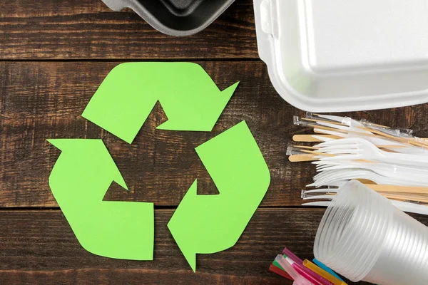 Eco symbol. recycling. Eco concept on brown wooden table. waste recycling. top view.