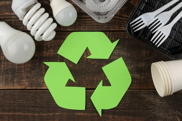 Eco symbol. recycling. Eco concept on brown wooden table. waste recycling. top view.