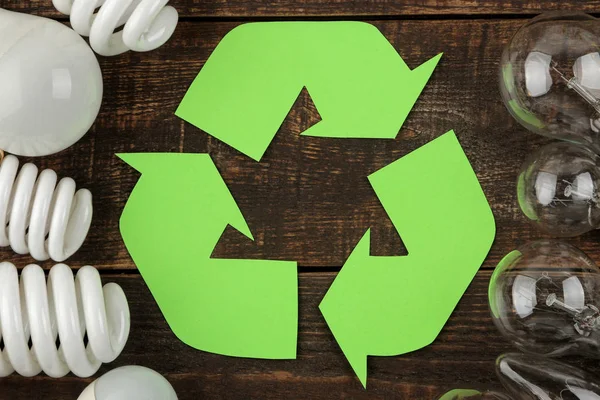 Eco symbol. recycling. Eco concept on brown wooden table. waste recycling. top view.