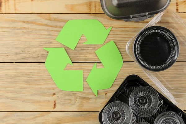 Eco symbol. recycling. eco concept on natural wooden table. waste recycling. view from above.