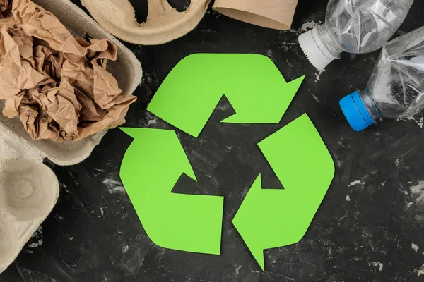 Eco symbol. recycling. eco concept on black concrete table. waste recycling. top view.