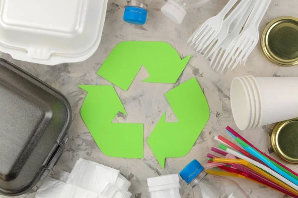 Eco symbol. recycling. eco concept on light concrete table. waste recycling. view from above.