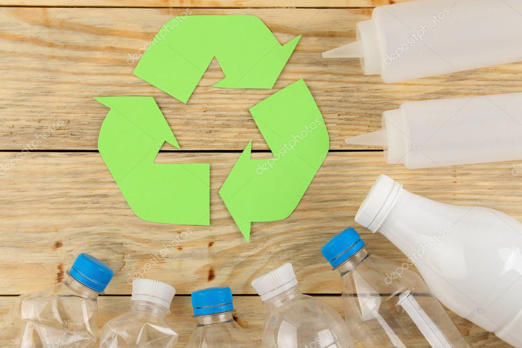 Eco symbol. recycling. eco concept on natural wooden table. waste recycling. view from above.