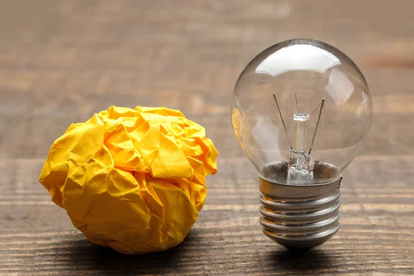 Concept creative idea. concept of creative idea. Bulbs of crumpled paper and light bulb. metaphor, inspiration.