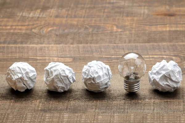 Concept creative idea. concept of creative idea. Bulbs of crumpled paper and light bulb. metaphor, inspiration.